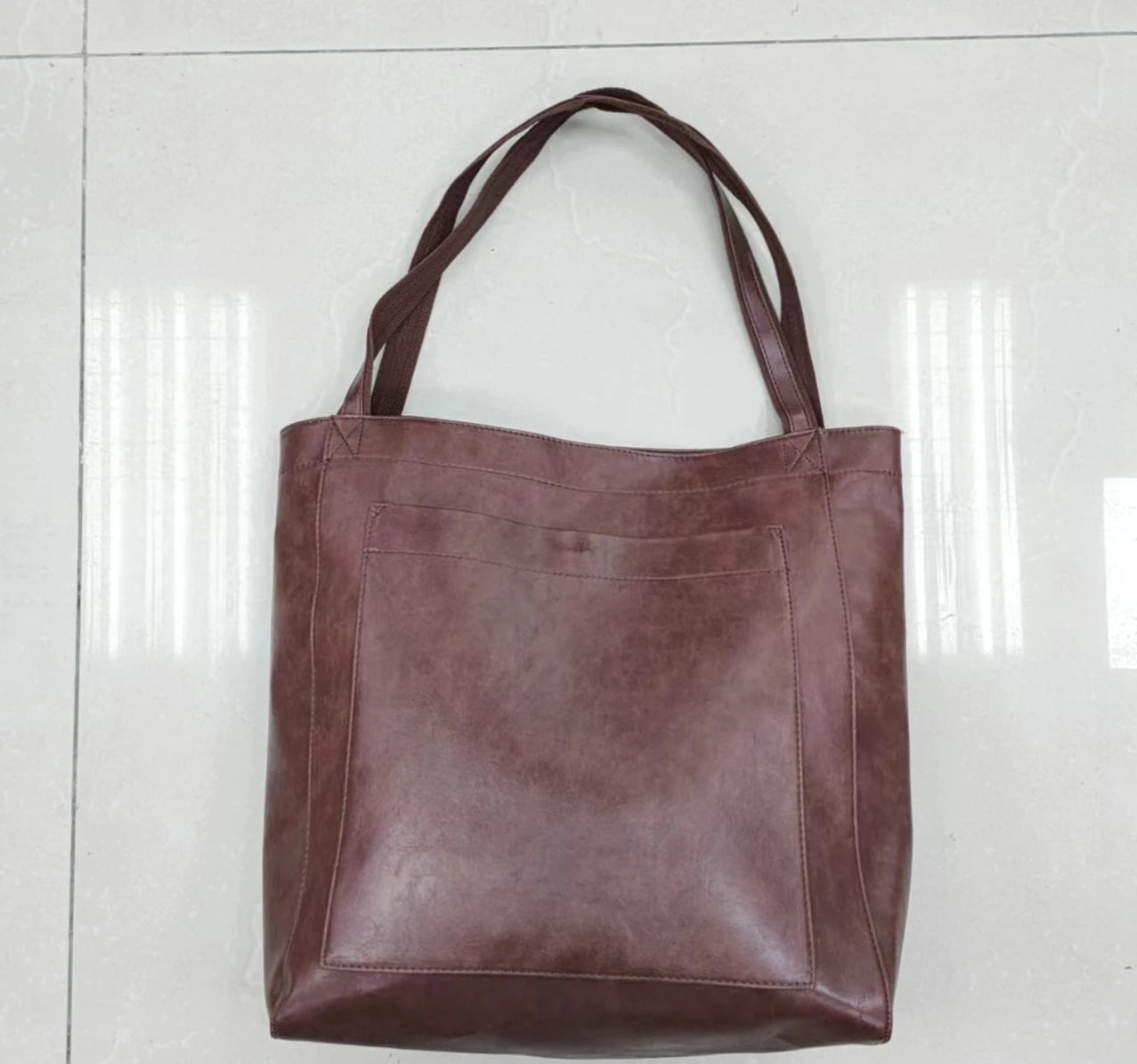Bolso de Mano Encerado Joker